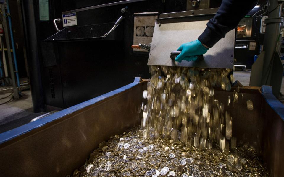 New one pound coins are produced at The Royal Mint's factory in Llantrisant. The institution manufactured 1.5bn of them as 12-sided coin entered circulation in 2017 - Jason Alden /Bloomberg