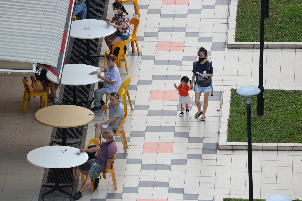 People dine-in at a coffee shop in Singapore. (Photo by Suhaimi Abdullah/NurPhoto via Getty Images)