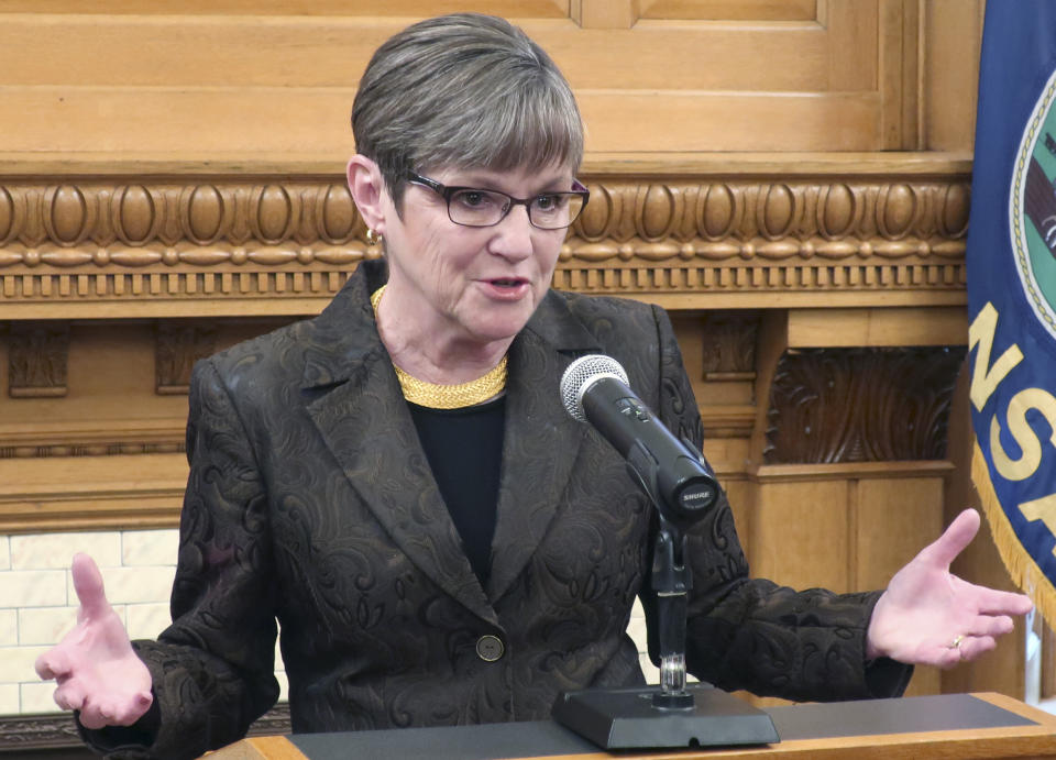 Kansas Gov. Laura Kelly answers questions from reporters as she announces her veto of a Republican tax relief bill during a news conference, Monday, March 25, 2019, at the Statehouse in Topeka, Kansas. The Democratic governor said the tax bill would have created a "self-inflicted budget crisis." (AP Photo/John Hanna)