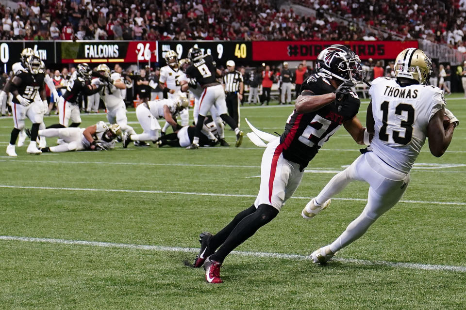 New Orleans Saints wide receiver Michael Thomas (13) makes a touchdown catch against the Atlanta Falcons during the second half of an NFL football game, Sunday, Sept. 11, 2022, in Atlanta. (AP Photo/Brynn Anderson)