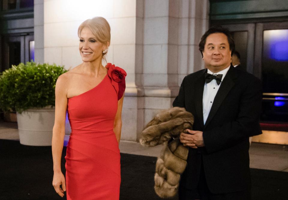 Donald Trump adviser Kellyanne Conway accompanied by her husband, George, speaks with members of the media as they arrive for a dinner at Union Station on Jan. 19, 2017, in Washington, the day before Trump's inauguration. The couple posted a joint statement on their Twitter accounts Saturday, March 4, 2023, announcing they are divorcing.