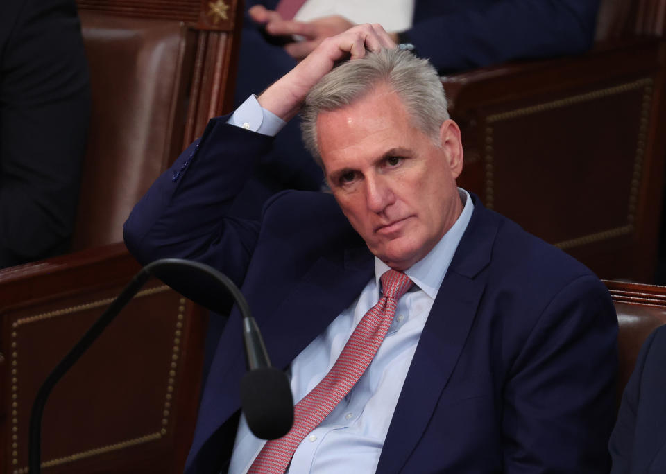 Rep. Kevin McCarthy scratches his head, looking tense.