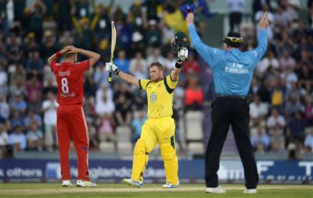 Australia's Aaron Finch celebrates after reaching his century from a six during the first T20 international against England at the Rose Bowl cricket ground, Southampton August 29, 2013. REUTERS/Philip Brown