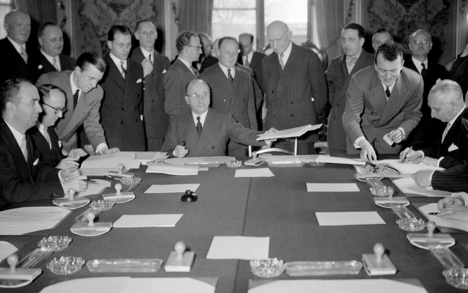 French delegation head Jean Monnet signs the treaty of the Schuman Plan which created the European Coal and Steel Community in Paris on March 19, 1951 - Credit: AFP/Getty Images