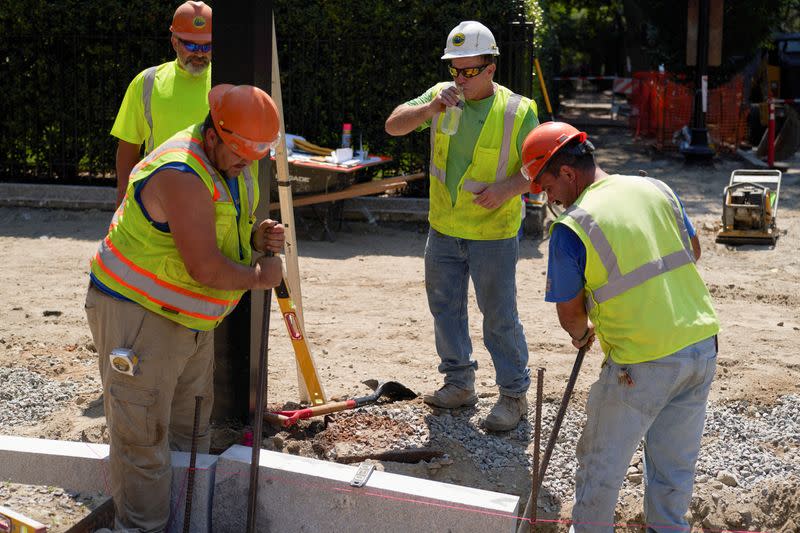 FILE PHOTO: A construction worker drinks water in Boston