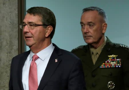 U.S. Defense Secretary Ash Carter (L) and Chairman of the Joint Chiefs of Staff Joseph Dunford (R) arrive to testify before a Senate Armed Services Committee hearing on National Security Challenges and Ongoing Military Operations on Capitol Hill in Washington, U.S., September 22, 2016. REUTERS/Yuri Gripas