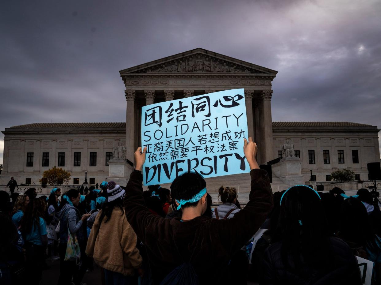 People rally in support of affirmative action in college admissions as arguments start on the cases at the Supreme Court on Capitol Hill on Monday, Oct 31, 2022 in Washington, DC.