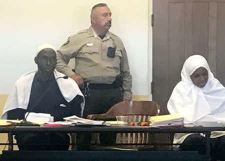 Defendant Subhannah Wahhaj (R) sits next to her husband, defendant Lucas Morton (L), during a hearing on charges of child abuse in which they were granted bail in Taos County, New Mexico, U.S. August 12, 2018. Picture taken August 12, 2018. REUTERS/Andrew Hay