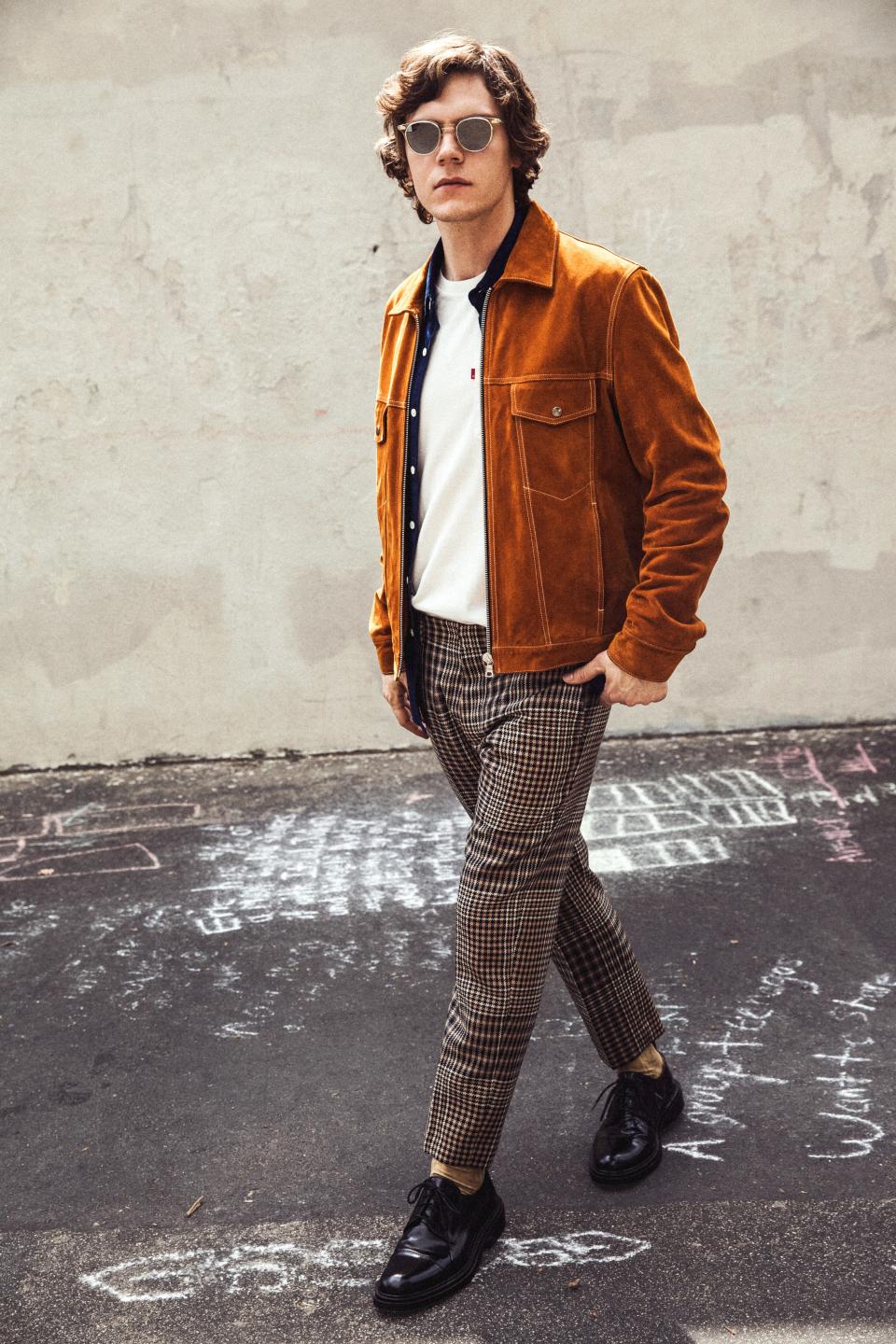 <cite class="credit">Jacket, $1,010, by Sandro / Shirt, $70, and T-shirt, $30, by Levi’s / Pants, $610, and shoes, $570, by AMI Alexandre Mattiussi / Socks, $29, by Pantherella</cite>