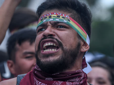 FILE PHOTO: A demonstrator shouts during a protest against Bolivia's President Evo Morales bid for re-election in 2019, Santa Cruz, Bolivia, December 11, 2018. REUTERS/Rodrigo Urzagasti/File Photo