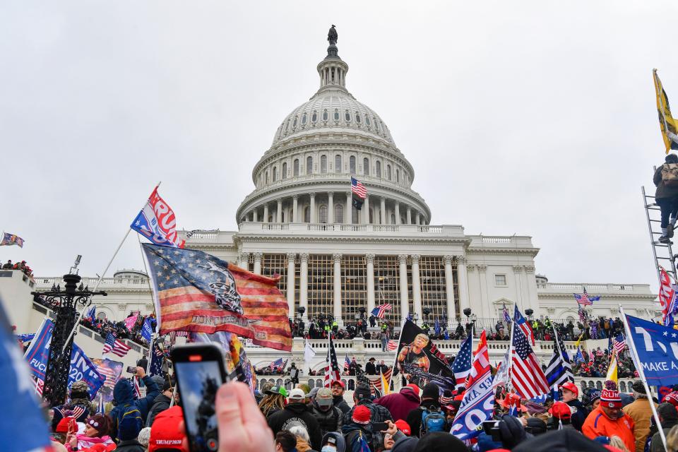 Rioters attack the U.S. Capitol on Jan. 6 as Congress meets to formally ratify Joe Biden as the winner of the 2020 presidential election.