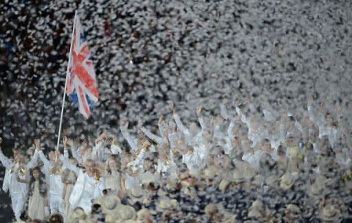 Britain's flagbearer Chris Hoy leads his team during their delegation parade in the opening ceremony of the London 2012 Olympic Games in the Olympic Stadium in London