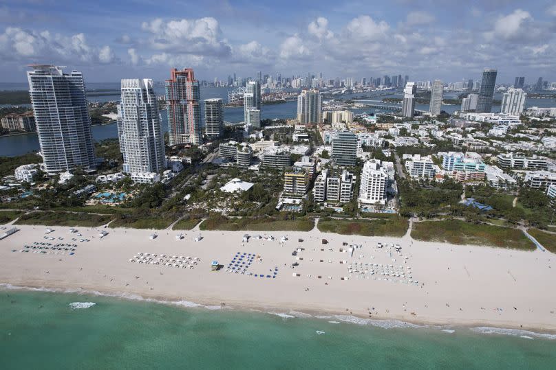 Chairs dot the wide sandy beach, in the South Beach area of Miami Beach