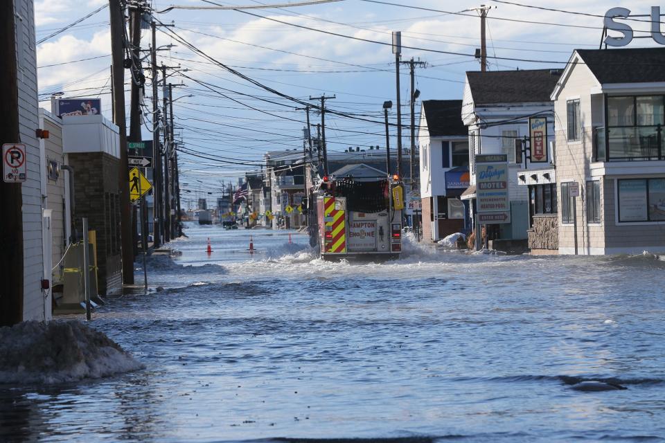 High tides brought flooding and closed roads to Hampton Beach side roads and Ocean Boulevard Jan. 10, 2024.