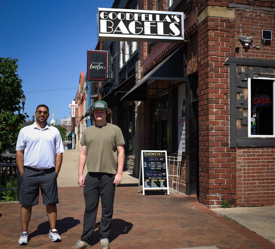 Owner Adrian Joseph and manager Noah Jacobson of GoodFellas Bagel Deli on East Michigan Avenue pose for a portrait Tuesday, June 21, 2022, in front of the downtown Lansing location.
