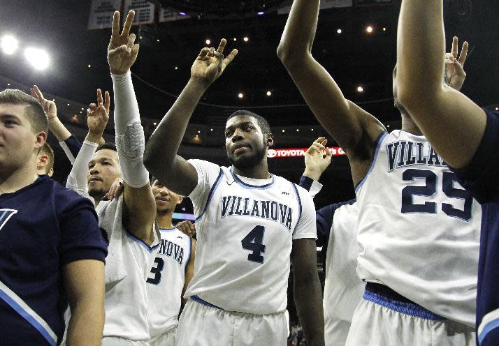 Villanova forward Eric Paschall (4) waves to the fans with the rest of the players after the team defeated Providence 78-68 in an NCAA college basketball game, Saturday, Jan. 21, 2017, in Philadelphia. (AP Photo/Laurence Kesterson)
