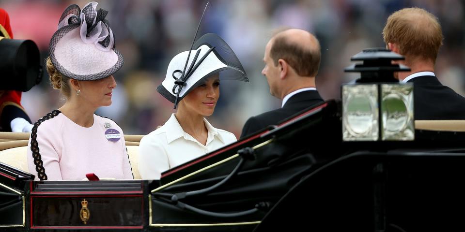 <p>Meghan Markle, Duchess of Sussex, arrived via carriage while Sophie, Countess of Wessex sat beside her.</p>