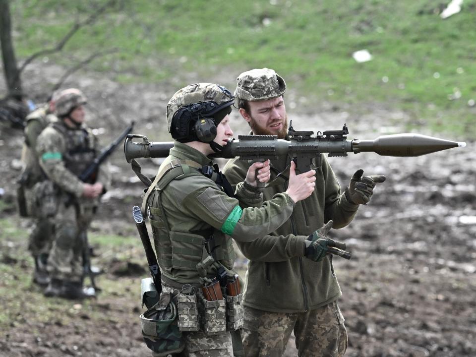 A Ukrainian serviceman prepares to fire a rocket-propelled grenade (RPG) from a launcher during a training exercise in the Donetsk region on April 7, 2023