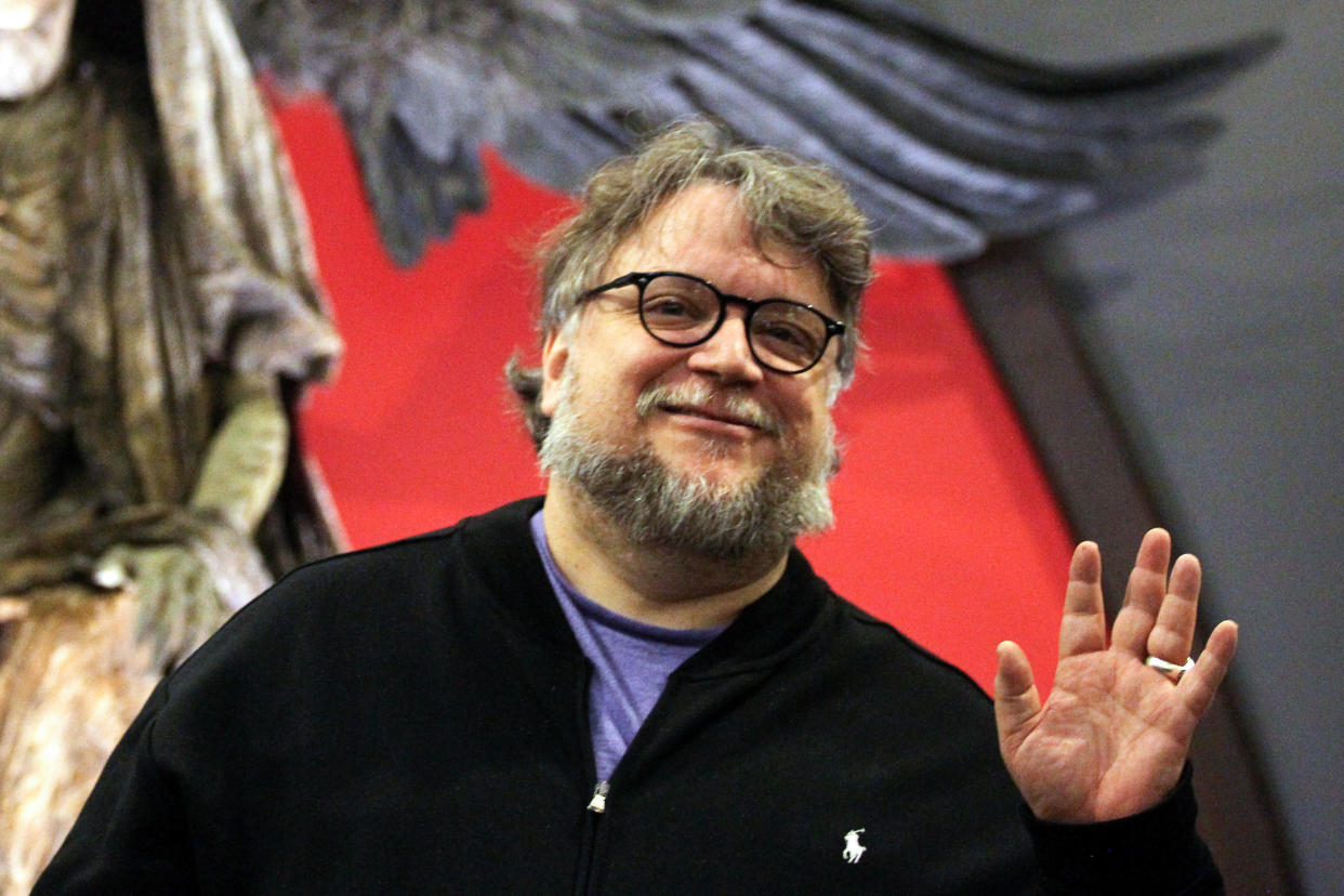 Mexican filmmaker Guillermo del Toro poses with the monster El Angel de la Muerte from the movie "Hellboy" on display at the "Guillermo del Toro, At home with my monsters" exhibition in Guadalajara, State of Jalisco, Mexico, on 29 May 2019. - Mexican filmmaker Del Toro presents his collection of personal objects and part of thiose he used in his films. (Photo by Ulises Ruiz / AFP)        (Photo credit should read ULISES RUIZ/AFP/Getty Images)