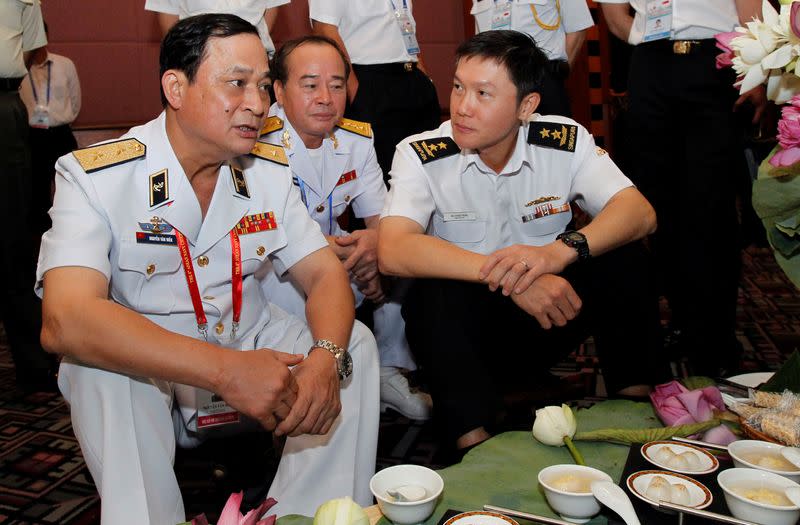 FILE PHOTO: Vietnam's Vice Defence Minister and Navy Commander in Chief Vice Admiral Nguyen chats with Singapore's Navy Chief Rear Admiral Ng along the sides of the 5th ASEAN Navy Chiefs meeting in Hanoi