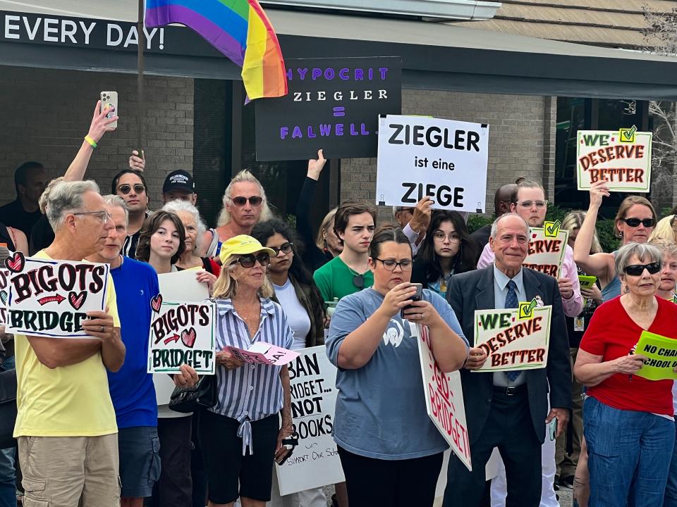 Protesters organized by the SEE Alliance rally to call on Sarasota School Board member Bridget Ziegler to resign before a school board meeting in March.