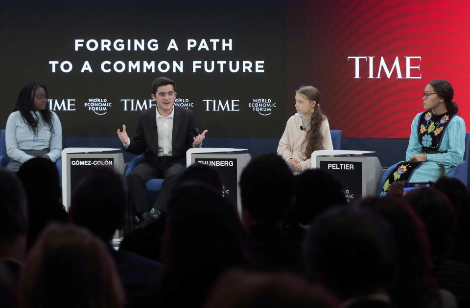 Swedish environmental activist Greta Thunberg, second right, Autumn Peltier, Chief Water Commissioner of the Anishinabek Nation, right, Salvador Gomez-Colon, founder of Light & Hope for Puerto Rico, second left, and Natasha Mwansa of the Natasha Mwansa Foundation, left, address the World Economic Forum in Davos, Switzerland, Tuesday, Jan. 21, 2020. The 50th annual meeting of the forum will take place in Davos from Jan. 20 until Jan. 24, 2020. (AP Photo/Markus Schreiber)