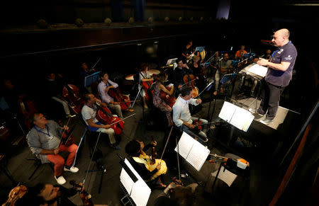 Performers take part in a dress rehearsal for the Barber of Seville ahead of the opening of the first Dubai Opera house, the UAE August 30, 2016. REUTERS/Ahmed Jadallah