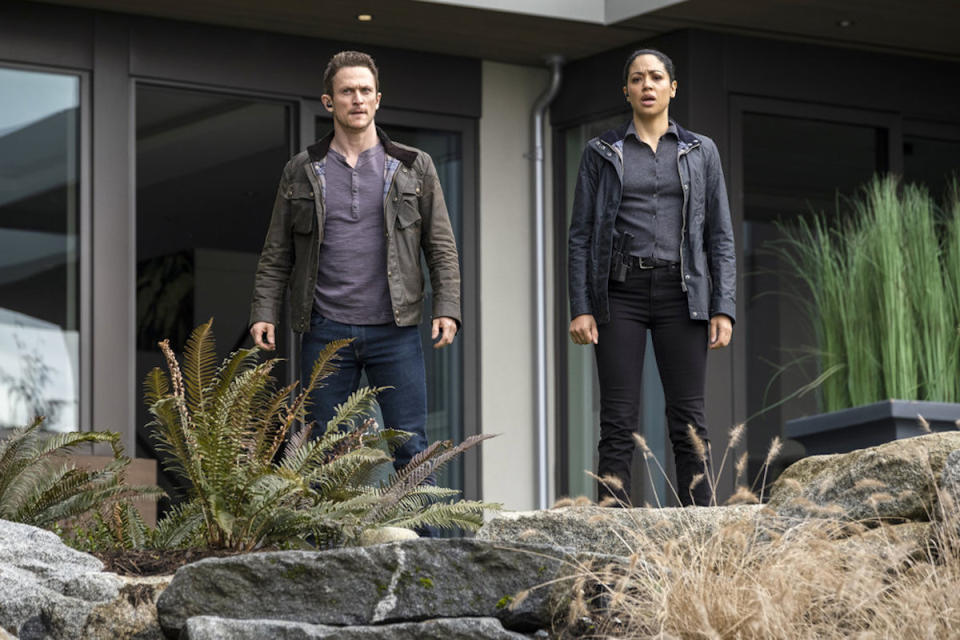 Bryan and Finola outside a house on Debris