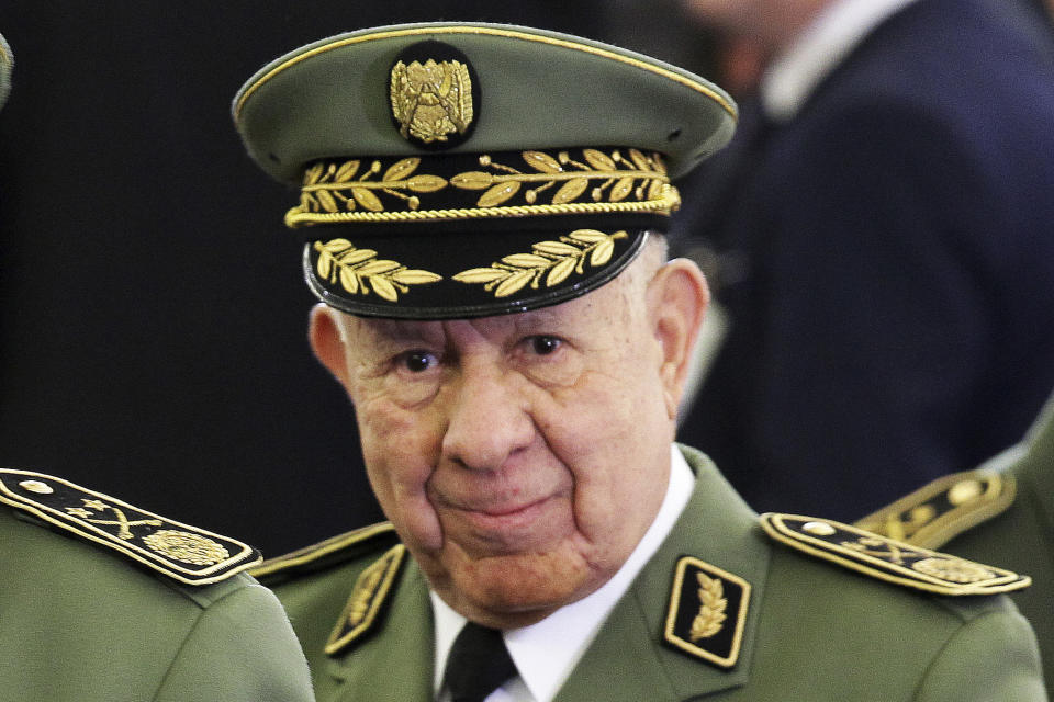 FILE - In this photo taken Thursday, Dec. 19, 2019, Algerian Gen. Said Chengriha attends president Abdelmajid Tebboune's inauguration ceremony in the presidential palace, in Algiers. Algeria's powerful military chief Gaid Salah died unexpectedly Monday, according to government media reports, leaving his country gripped by political uncertainty after 10 months of pro-democracy protests. Gaid Salah is being replaced on a temporary basis by another high-ranking general, Said Chengriha. (AP Photo/Fateh Guidoum, File)