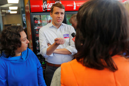 Democratic candidate for the U.S. Congress Chris Pappas greets voters at the Bridge Cafe ahead New Hampshire's primary election in Manchester, New Hampshire, U.S., September 10, 2018. REUTERS/Brian Snyder