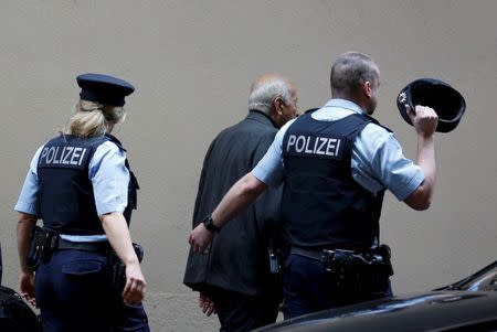 Police officers escort people at Duesseldorf airport March 24, 2015. REUTERS/Ina Fassbender