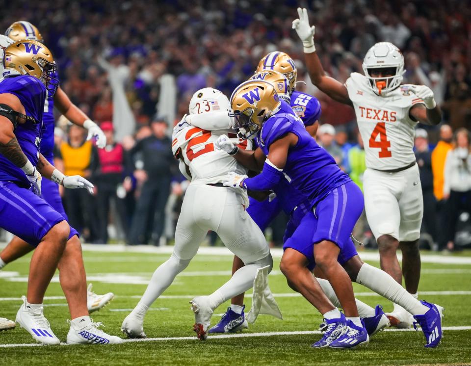 Texas Longhorns running back Jaydon Blue (23) scores the first touchdown for Texas in the first quarter of the Sugar Bowl College Football Playoff semi-finals at the Ceasars Superdome in New Orleans, Louisiana, Jan. 1, 2024. The Texas Longhorns take on the Washington Huskies for a spot in the College Football Playoff Finals.