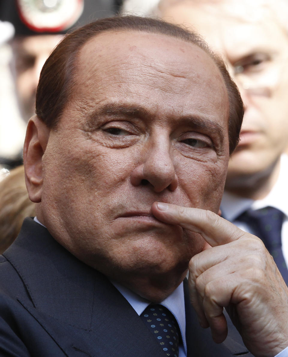 FILE - In this May 11, 2012 file photo Italian former Premier Silvio Berlusconi attends a funeral service in Milan, Italy. Berlusconi is reportedly considering running for office when Italian Premier Mario Monti's term will end next spring. His close ally Angelo Alfano, PDL, People for Freedom, party secretary, said Wednesday, July 11, 2012 he believes in the end Berlusconi will decide to run. Berlusconi is currently on trial on charges he paid for sex with an underage Moroccan girl and used his office to try to cover it up. (AP Photo/Luca Bruno, file)