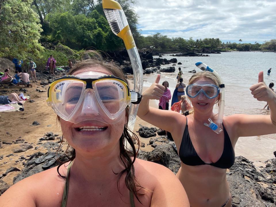 Teaghan and friend wearing snorkels on the beach