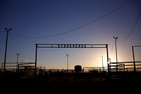 The cattle yards for the Queensland outback town of Stonehenge are silhouetted by the sunset in Australia, August 12, 2017. REUTERS/David Gray