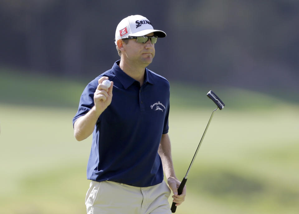 George McNeill saves par on the eighth hole in the third round of the Northern Trust Open golf tournament at Riviera Country Club in the Pacific Palisades area of Los Angeles Saturday, Feb. 15, 2014. (AP Photo/Reed Saxon)