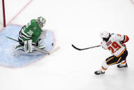 Calgary Flames' Dillon Dube (29) is stopped by Dallas Stars goalie Anton Khudobin (35)] during the first period in Game 1 of an NHL hockey Stanley Cup first-round playoff series, Tuesday, Aug. 11, 2020, in Edmonton, Alberta. (Jason Franson/The Canadian Press via AP)