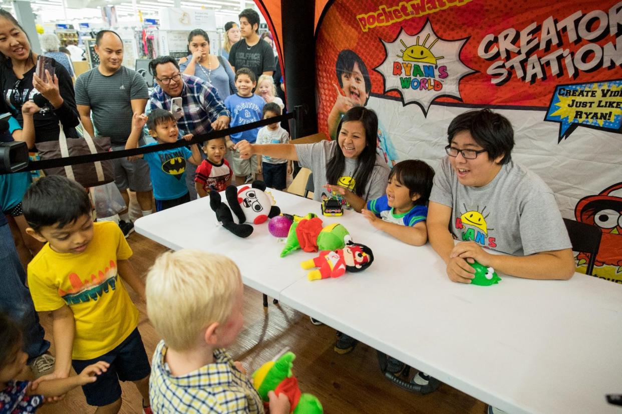 Pictured: Ryan and his parents, Loann and Shion, at a Walmart store event in Bentonville, Arkansas in July. (Photo courtesy of Walmart)