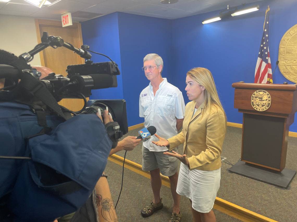Don Harris, a veterinarian, and Raquel Regalado, a Miami-Dade County Commissioner, talk to the media about a new county-approved plan by Pinecrest to hire Harris to perform vasectomies on wild peacocks. By DOUGLAS HANKS/dhanks@miamiherald.com