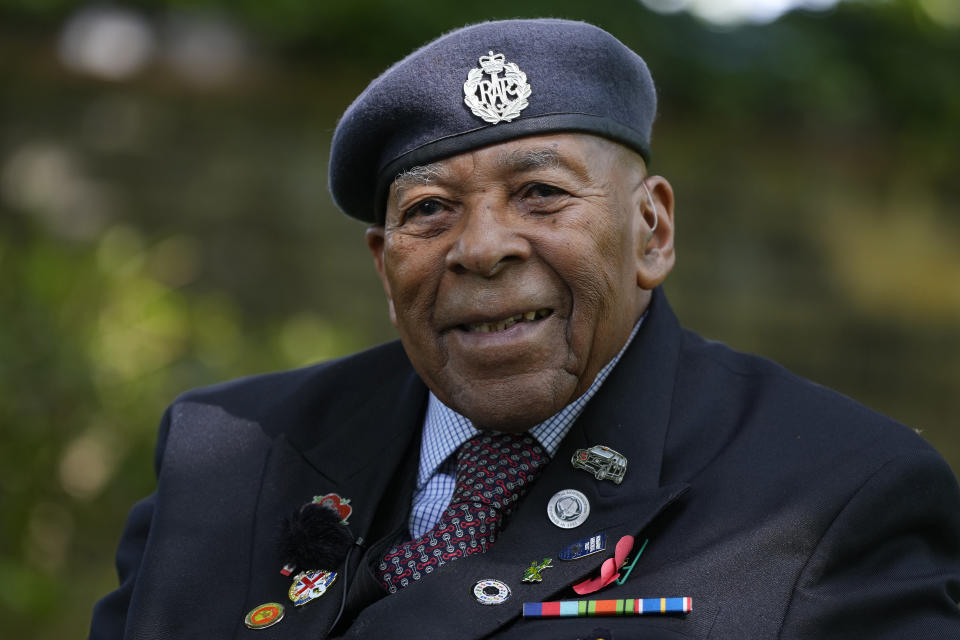 Gilbert Clarke a D-Day veteran smiles as he is interviewed near his home in east London, Wednesday, May 15, 2024. Clarke, now 98, is one of more than 3 million men and women from South Asia, Africa and the Caribbean who served in the British military during World War II. (AP Photo/Kirsty Wigglesworth)