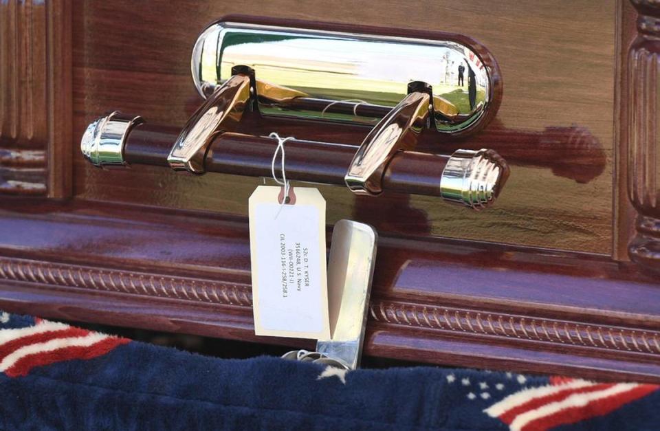 The casket containing the remains of Seaman 2nd Class Denver True “D.T.” Kyser is laid to rest at Fresno Memorial Gardens Saturday afternoon, May 21, 2022 in Fresno.