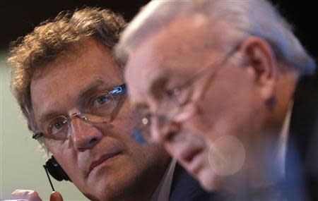 FIFA Secretary General Jerome Valcke (L) looks on as the President of Brazilian Soccer Confederation Jose Maria Marin talks during a news conference at the Maracana stadium in Rio de Janeiro March 27, 2014. REUTERS/Ricardo Moraes