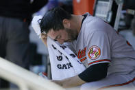 Baltimore Orioles starting pitcher Matt Harvey wipes his face with a towel in the dugout before a baseball game against his former team, the New York Mets, Wednesday, May 12, 2021, in New York. (AP Photo/Kathy Willens)