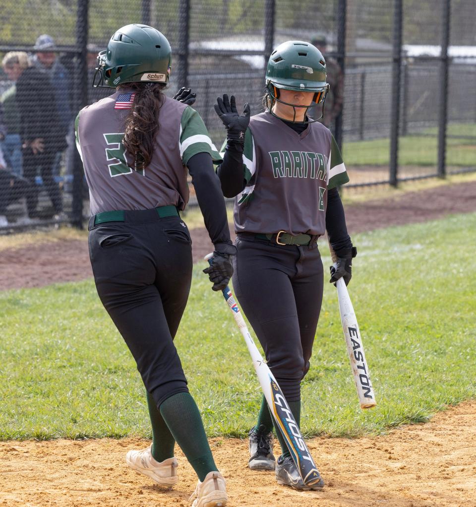 Raritan’s Scarlett O’Hea gets a high five after scoring fourth Rarittan run of game. Raritan Softball defeats Holmdel 5-2 on April 19, 2024 in Holmdel, NJ.