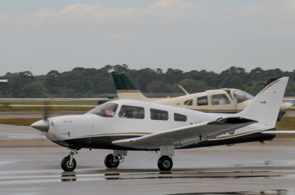 An incoming student Piper Archer III aircraft taxis across the tarmac as another prepares for takeoff  at the Treasure Coast International Airport on Wednesday, March 15, 2023, in St. Lucie County.