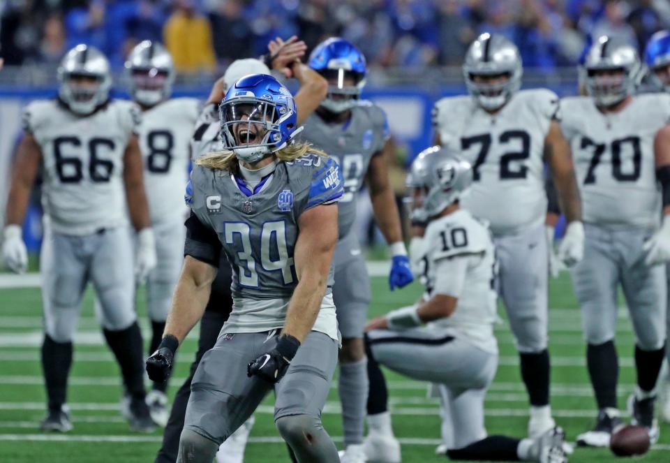 Detroit Lions linebacker Alex Anzalone celebrates his sack on Las Vegas Raiders quarterback Jimmy Garoppolo (10) during the second half at Ford Field, Monday, Oct. 30, 2023.