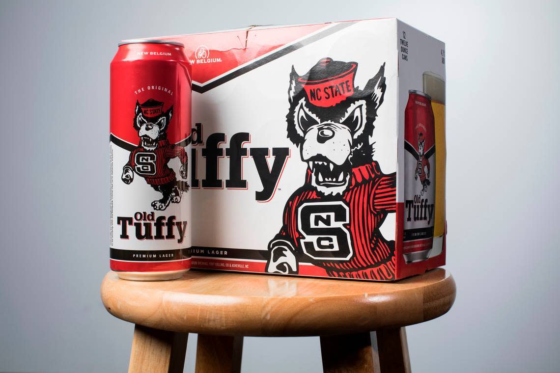 Photo by Julia Wall/News & Observer<br>Old Tuffy, a New Belgium lager, hit the shelves in the first week of August 2019. The brewing company announced the Wolfpack-themed beer earlier this summer, kicking off a five-year collaboration with NC State.