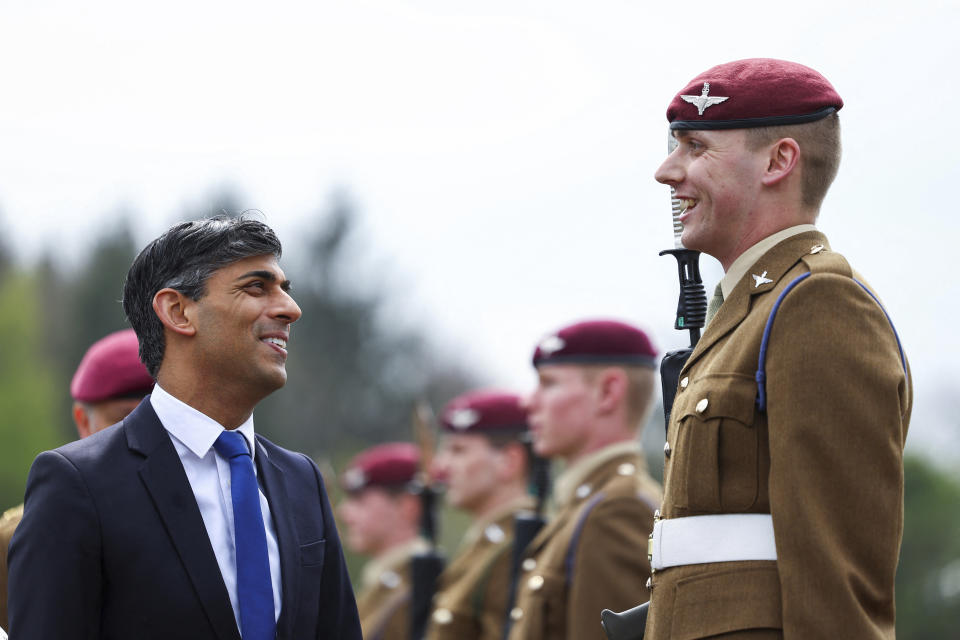 Britain's Prime Minister Rishi Sunak smiles as he inspects the Passing Out Parade of the Parachute Regiment recruits during his visit to the Helles Barracks at the Catterick Garrison, a military base in North Yorkshire, Britain, Friday, May 3, 2024. (Molly Darlington/Pool photo via AP)