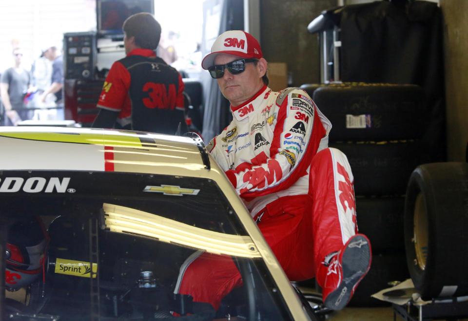 Sprint Cup Series driver Jeff Gordon (24) climbs into his car during practice for the NASCAR Brickyard 400 auto race at Indianapolis Motor Speedway in Indianapolis, Friday, July 24, 2015. (AP Photo/R Brent Smith)