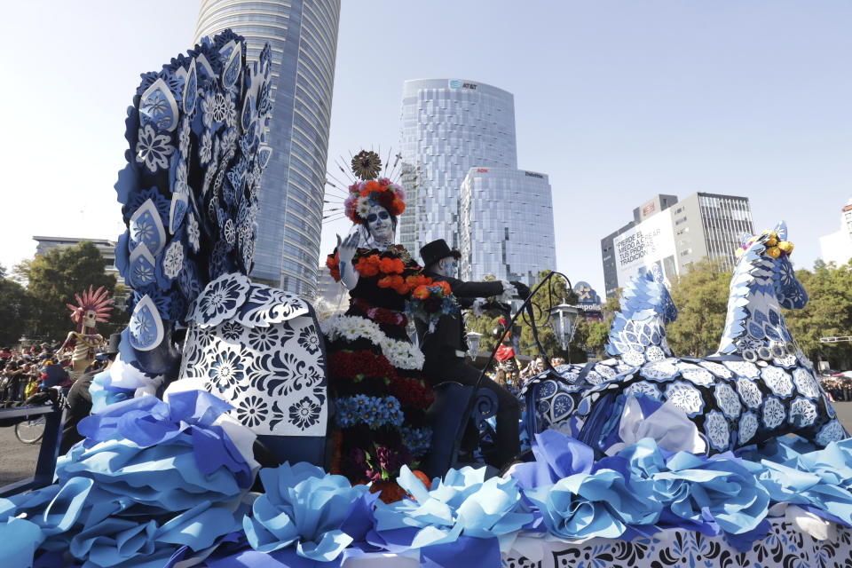 Participants take part in a James Bond-inspired Day of the Dead Parade, in Mexico City, Saturday, Nov. 4, 2023. The Hollywood-style parade was adopted in 2016 by Mexico City to mimic a fictitious march in the 2015 James Bond movie “Spectre.” (AP Photo/Ginnette Riquelme)